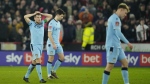 Wrexham players look dejected after Sheffield's Billy Sharp scored his side's second goalduring the FA Cup 4th round soccer match between Sheffield United and Wrexham at the Bramall Lane stadium in Sheffield, England, Tuesday, Feb. 7, 2023. (AP Photo/Jon Super)