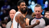 Kyrie Irving reacts during the second half of an NBA basketball game against the New York Knicks, Saturday, Jan. 28, 2023, in New York. The Nets won 122-115. (AP Photo/Mary Altaffer)