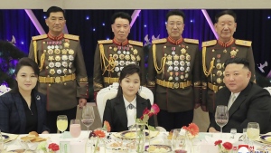 In this photo provided by the North Korean government, North Korean leader Kim Jong Un, right, with his wife Ri Sol Ju, left, and his daughter poses with military top officials for a photo at a feast to mark the 75th founding anniversary of the Korean People’s Army at an unspecified place in North Korea Tuesday, Feb. 7, 2023. Independent journalists were not given access to cover the event depicted in this image distributed by the North Korean government. The content of this image is as provided and cannot be independently verified. Korean language watermark on image as provided by source reads: "KCNA" which is the abbreviation for Korean Central News Agency. (Korean Central News Agency/Korea News Service via AP)