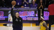 Kareem Abdul-Jabbar, left, holds up the ball before handing it to Los Angeles Lakers forward LeBron James after James passed Abdul-Jabbar to become the NBA's all-time leading scorer during the second half of an NBA basketball game against the Oklahoma City Thunder Tuesday, Feb. 7, 2023, in Los Angeles. (AP Photo/Marcio Jose Sanchez)