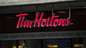 Tim Hortons signage is pictured in Ottawa on Wednesday Sept. 7, 2022. The master franchisee of Tim Hortons coffee shops in China says it has entered into a transaction for the exclusive development of Popeyes in mainland China and Macau. THE CANADIAN PRESS/Sean Kilpatrick