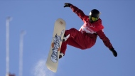 Canada's Brooke D'Hondt trains on the halfpipe course at the 2022 Winter Olympics, Tuesday, Feb. 8, 2022, in Zhangjiakou, China. D'Hondt has dropped into Calgary's halfpipe a 10-minute drive from her house more times than she can count, but the snowboarder competes in her first hometown World Cup there starting Thursday. THE CANADIAN PRESS/AP/Francisco Seco