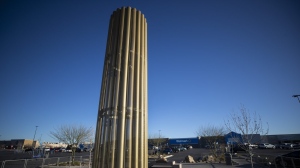 A towering memorial, in the form of a giant candle, to the victims of the August 2019 mass shooting in El Paso, Texas, is pictured on Wednesday, Feb. 8, 2023. Patrick Crusius, the defendant in the deaths of 23 people at an El Paso Walmart is expected to plead guilty during a re-arraignment hearing in federal court. (AP Photo/Andrés Leighton)