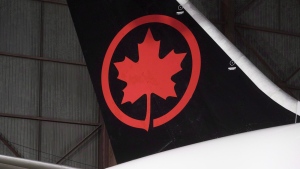 The tail of the newly revealed Air Canada Boeing 787-8 Dreamliner aircraft is seen at a hangar at the Toronto Pearson International Airport in Mississauga, Ont., Thursday, February 9, 2017. THE CANADIAN PRESS/Mark Blinch