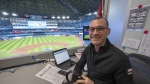 Toronto Blue Jays announcer Ben Wagner sits in the broadcast booth in Toronto, Sunday, April 10, 2022. Sportsnet, the Blue Jays' radio rightsholder, will not resume on-site radio broadcasts for the 2023 regular season and will instead use remote coverage from its downtown Toronto studio for road games. THE CANADIAN PRESS/Frank Gunn