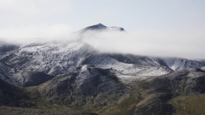 As climate change pushes some plants northward, a new study suggests several unique species in Yukon and Alaska could have nowhere to go. Snow-covered hills in the Porcupine River Tundra in the Yukon Territories, Wednesday, Aug. 12, 2009. THE CANADIAN PRESS/AP-Rick Bowmer