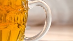 A file photo of a glass filled with beer.
