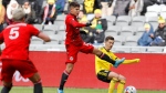 Toronto FC defender Kadin Chung, left, goes for the ball against Columbus Crew forward Pedro Santos during the second half of an MLS soccer match on Saturday, March 12, 2022, in Columbus, Ohio. (AP Photo/Joe Maiorana)