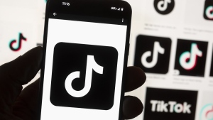 The TikTok logo is seen on a cellphone on Oct. 14, 2022, in Boston. TikTok says every account held by a user under the age of 18 will automatically be set to a 60-minute daily screen time limit in the coming weeks amid growing concerns about the app's security. (AP Photo/Michael Dwyer, File)