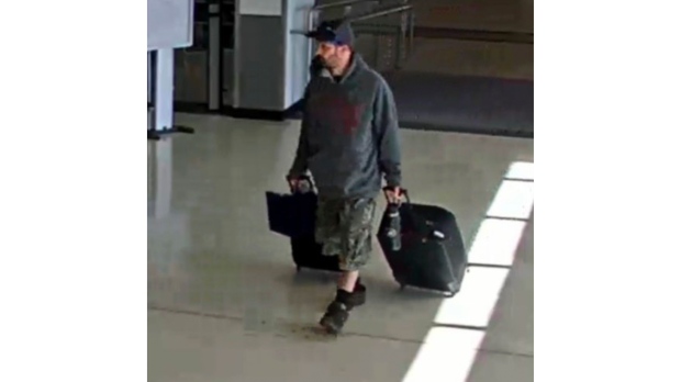This airport surveillance camera image released in an FBI affidavit shows alleged suspect Marc Muffley at Lehigh Valley International Airport in Allenstown, Pa., on Monday, Feb. 27, 2023. Muffley was arrested Monday after an explosive was found in a bag checked onto a Florida-bound flight, federal authorities said. (FBI via AP)