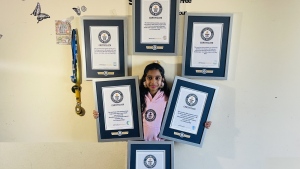 Mamathi Vinoth, 9, is shown with her Guinness world records in an undated handout photo. Vinoth practised hula hooping almost every day after school until bedtime before she spun and hopped her way through three Guinness World Records. THE CANADIAN PRESS/HO-Kadambari Vinoth