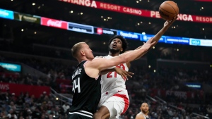Toronto Raptors' Thaddeus Young (21) puts up a shot against Los Angeles Clippers' Mason Plumlee (44) during first half of an NBA basketball game Wednesday, March 8, 2023, in Los Angeles. (AP Photo/Jae C. Hong)