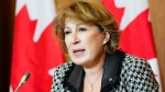 FILE - Chief Science Advisor Mona Nemer provides an update on COVID-19, post-COVID condition, and other public health concerns during a press conference in Ottawa on Wednesday, Dec. 14, 2022. THE CANADIAN PRESS/Sean Kilpatrick 