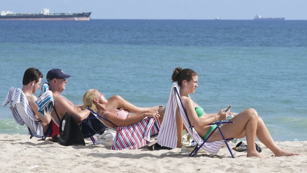 Airports and airlines are preparing for a surge in passengers ahead of spring break. Beachgoers face the sun on Fort Lauderdale beach, Thursday, Dec. 22, 2022, in Fort Lauderdale, Fla. THE CANADIAN PRESS/AP-Marta Lavandier