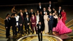The cast and crew of "Everything Everywhere All at Once" accepts the award for best picture at the Oscars on Sunday, March 12, 2023, at the Dolby Theatre in Los Angeles. (AP Photo/Chris Pizzello)