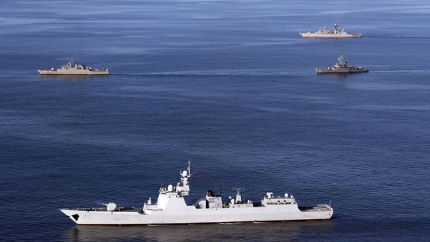 warships sail in the Sea of Oman