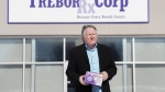 George Irwin, owner of Trebor RX Corp., which manufactured PPE masks for the COVID-19 pandemic, poses for a photograph outside what was his business before it went into receivership in Collingwood, Ont., on Wednesday, March 15, 2023. Both the federal and provincial governments have not bought any PPE from domestic companies after imploring them to help make PPE in the early days of the pandemic. THE CANADIAN PRESS/Nathan Denette
