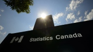 Statistics Canada building and signs are pictured in Ottawa on Wednesday, July 3, 2019. Canada's inflation rate likely took another dip last month, but with many Canadians still struggling with the cost of living, the federal government is facing pressure to deliver more help in the upcoming budget. THE CANADIAN PRESS/Sean Kilpatrick