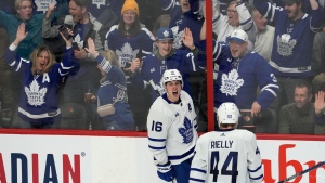 Fans react as Toronto Maple Leafs right wing Mitchell Marner celebrates his goal during second period NHL action against the Ottawa Senators, in Ottawa, Saturday, March 18, 2023. THE CANADIAN PRESS/Adrian Wyld