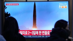 A TV screen shows a file image of North Korea's missile launch during a news program at the Seoul Railway Station in Seoul, South Korea, Sunday, March 19, 2023. North Korea launched a short-range ballistic missile toward the sea on Sunday, its neighbors said, ramping up testing activities in response to U.S.-South Korean military drills that it views as an invasion rehearsal. (AP Photo/Ahn Young-joon)