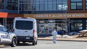 Forensics on the scene at Charles P. Allen High School in Halifax, Monday, March 20, 2023. A student was arrested after three people were stabbed Monday morning at a high school in the Halifax area, police say. THE CANADIAN PRESS/Riley Smith