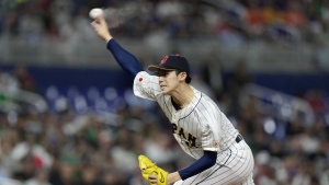 Japan's Roki Sasaki delivers a pitch during the first inning of a World Baseball Classic game against Mexico, Monday, March 20, 2023, in Miami. (AP Photo/Wilfredo Lee)
