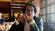 In this photo provided by Ibrahim Almadi, Saad Ibrahim Almadi sits in a restaurant in an unidentified place, in the United States, on August 2021. Saudi Arabia has freed the Saudi-American citizen it had imprisoned more than a year over his old tweets critical of the kingdom’s crown prince. (Ibrahim Almadi via AP)