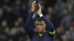 PSG's Kylian Mbappe applauds fans at the end of the French League One soccer match between Paris Saint-Germain and Rennes at the Parc des Princes in Paris, Sunday, March 19, 2023. (AP Photo/Christophe Ena)