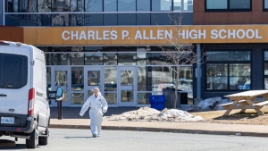Forensics on the scene at Charles P. Allen High School in Halifax, Monday, March 20, 2023. The Halifax school where two staff were stabbed on Monday is reopening today with counselling being provided.THE CANADIAN PRESS/Riley Smith