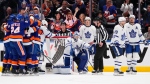 Toronto Maple Leafs goaltender Ilya Samsonov (35) and Calle Jarnkrok (19) react with teammates as the New York Islanders celebrate a goal by Simon Holmstrom during the third period of an NHL hockey game Tuesday, March 21, 2023, in Elmont, N.Y. The Islanders won 7-2. (AP Photo/Frank Franklin II)
