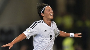 In this Sept. 7, 2012, file photo, Germany's man of the match Mesut Ozil celebrates after scoring during the Brazil World Cup 2014 group C qualifying soccer match between Germany and Faroe Islands in Hannover, Germany. Former Germany midfielder Mesut Özil, who won the World Cup in 2014, retired from soccer Wednesday, March 22, 2023, at the age of 34. (AP Photo/Martin Meissner, File)
