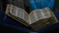 The Codex Sassoon 1,100-year-old Hebrew Bible is on display at the Tel Aviv's ANU Museum of the Jewish People for a week-long exhibition of the manuscript, part of a whirlwind worldwide tour of the artifact in the United Kingdom, Israel and the United States before its expected sale, Israel, Wednesday, March 22, 2023. One of the oldest surviving biblical manuscripts is up for sale — for a cool $30 million. The Codex Sassoon is a nearly complete 1,100-year-old Hebrew Bible. Sotheby's is putting it up for auction in New York in May for an estimated price of $30 million to $50 million. (AP Photo/Ariel Schalit)