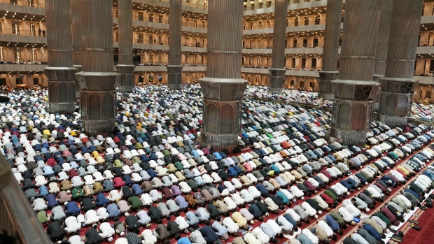 Indonesian Muslims perform an evening prayer called 'tarawih' marking the first eve of the holy fasting month of Ramadan, at Istiqlal Mosque in Jakarta, Indonesia, Wednesday, March 22, 2023. Millions of Muslims in Indonesia are gearing up to celebrate the holy month of Ramadan, which is expected to start on Thursday, with traditions and ceremonies across the world's most populous Muslim-majority country amid soaring food prices. (AP Photo/Achmad Ibrahim)
