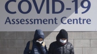 People leave a COVID-19 assessment centre Saturday, March 14, 2020 in Ottawa. The Canadian Press has learned that Ontario will not extend its temporary sick day program.Two senior government sources say the COVID-19 sick day program that provided three days off to workers during the pandemic will expire at the end of the month.THE CANADIAN PRESS/Adrian Wyld