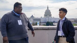 TikTok influencers Jason Linton, left, and Gohar Khan talk between interviews during a media availability, Wednesday, March 22, 2023, in Washington. (AP Photo/Jess Rapfogel)