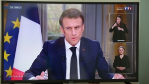 French President Emmanuel Macron is pictured on national television in Saint-Pee sur Nivelle, south-western France, Wednesday, March 22, 2023. French President Emmanuel Macron appeared on national television on Wednesday for the first time since his government forced through the bill age amid mass protests. (AP Photo/Bob Edme)
