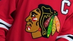 FILE - The Chicago Blackhawks' logo is seen during an NHL hockey game on Jan. 19, 2023, in Philadelphia. The Blackhawks will not wear Pride-themed warmup jerseys before Sunday's March 26, 2023, Pride Night game against Vancouver because of security concerns involving a Russian law that expands restrictions on activities seen as promoting LGBTQ rights in the country. (AP Photo/Matt Slocum, File)