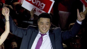 Provincial Liberal candidate Han Dong celebrates with supporters while taking part in a rally in Toronto on Thursday, May 22, 2014. THE CANADIAN PRESS/Nathan Denette