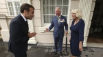 FILE - Britain's Prince Charles and Camilla, Duchess of Cornwall welcome French president Emmanuel Macron to Clarence House in London, Thursday June 18, 2020. Unrest in France is tarnishing the sheen of King Charles III’s first overseas trip as monarch. Striking workers have refused to provide red carpets and critics are calling for the British king's visit to be canceled altogether amid pension reform protests. (Jonathan Brady/Pool via AP, File)