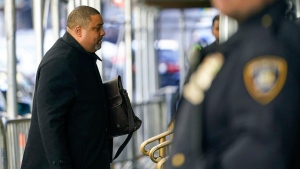 A court officer stands guard as Manhattan District Attorney Alvin Bragg arrives at his office, Thursday, March 23, 2023, in New York. A New York grand jury investigating Trump over a hush money payment to a porn star appears poised to complete its work soon as law enforcement officials make preparations for possible unrest in the event of an indictment. (AP Photo/Mary Altaffer)
