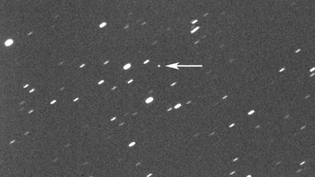 This photo provided by Gianluca Masi shows asteroid 2023 DZ2, indicated by arrow at center, on March 22, 2023. On Saturday, March 25, 2023, the asteroid, big enough to wipe out a city, will harmlessly zip between Earth and the moon. While asteroid flybys are common, NASA said itâ€™s rare for one so big to come so close _ about once a decade. Scientists estimate its size somewhere between 140 feet and 310 feet. (42 meters and 94 meters). (Gianluca Masi/Virtual Telescope Project via AP)