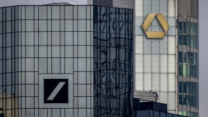 The headquarters of the German banks, Deutsche Bank, left, and Commerzbank are pictured in Frankfurt, Germany, Friday, March 17, 2023. (AP Photo/Michael Probst)