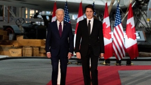 U.S. President Joe Biden, left, and Prime Minister Justin Trudeau arrive for an official dinner in Ottawa on Friday, March 24, 2023. More than 350 guests have assembled in the main hall of the Canadian Aviation and Space Museum for a gala dinner in honour of President Biden. THE CANADIAN PRESS/Spencer Colby