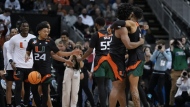 Miami celebrates after their win against Houston in a Sweet 16 college basketball game in the Midwest Regional of the NCAA Tournament Friday, March 24, 2023, in Kansas City, Mo. (AP Photo/Jeff Roberson)