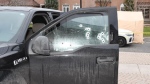 Bullet defects to the Ford F150 pick-up truck. (Photo from SIU report)