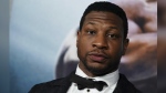 FILE - Jonathan Majors arrives at the premiere of "Creed III" on Feb. 27, 2023, at TCL Chinese Theatre in Los Angeles. The arrest of actor Majors on Saturday, March 25, 2023, has upended the Army’s newly launched advertising campaign that was aimed at reviving the service’s struggling recruiting numbers. (Photo by Jordan Strauss/Invision/AP, File)