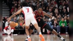 Detroit Pistons guard Killian Hayes (7) and Toronto Raptors forward O.G. Anunoby (3) battle for the ball during first half NBA basketball action in Toronto on Friday, March 24, 2023. THE CANADIAN PRESS/Frank Gunn