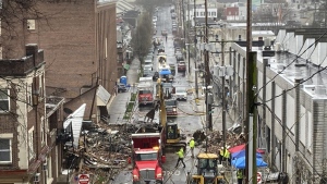 Emergency responders and heavy equipment are seen at the site of a deadly explosion at a chocolate factory in West Reading, Pennsylvania, Saturday, March 25. (AP Photo/Michael Rubinkam)