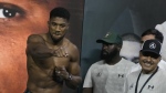 FILE - Heavyweight boxer Britain's Anthony Joshua, left, gestures during the weigh-in at King Abdullah Sports City in Jeddah, Saudi Arabia, Friday, Aug. 19, 2022. Joshua has been facing a new reality in recent months. He has been the poster boy of boxing’s heavyweight division for so long but suddenly the British fighter is on the outside looking in. His star has fallen in the wake of back-to-back losses to Oleksandr Usyk that have led many to question Joshua’s ability even as a two-time world champion. (AP Photo/Hassan Ammar, File)