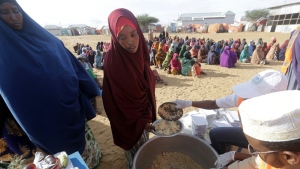 Local NGO prepares Iftar food for people at an internally displaced people camp on the outskirts of Mogadishu, Somalia, Friday, March 24, 2023. This year's holy month of Ramadan coincides with the longest drought on record in Somalia. (AP Photo/Farah Abdi Warsameh)